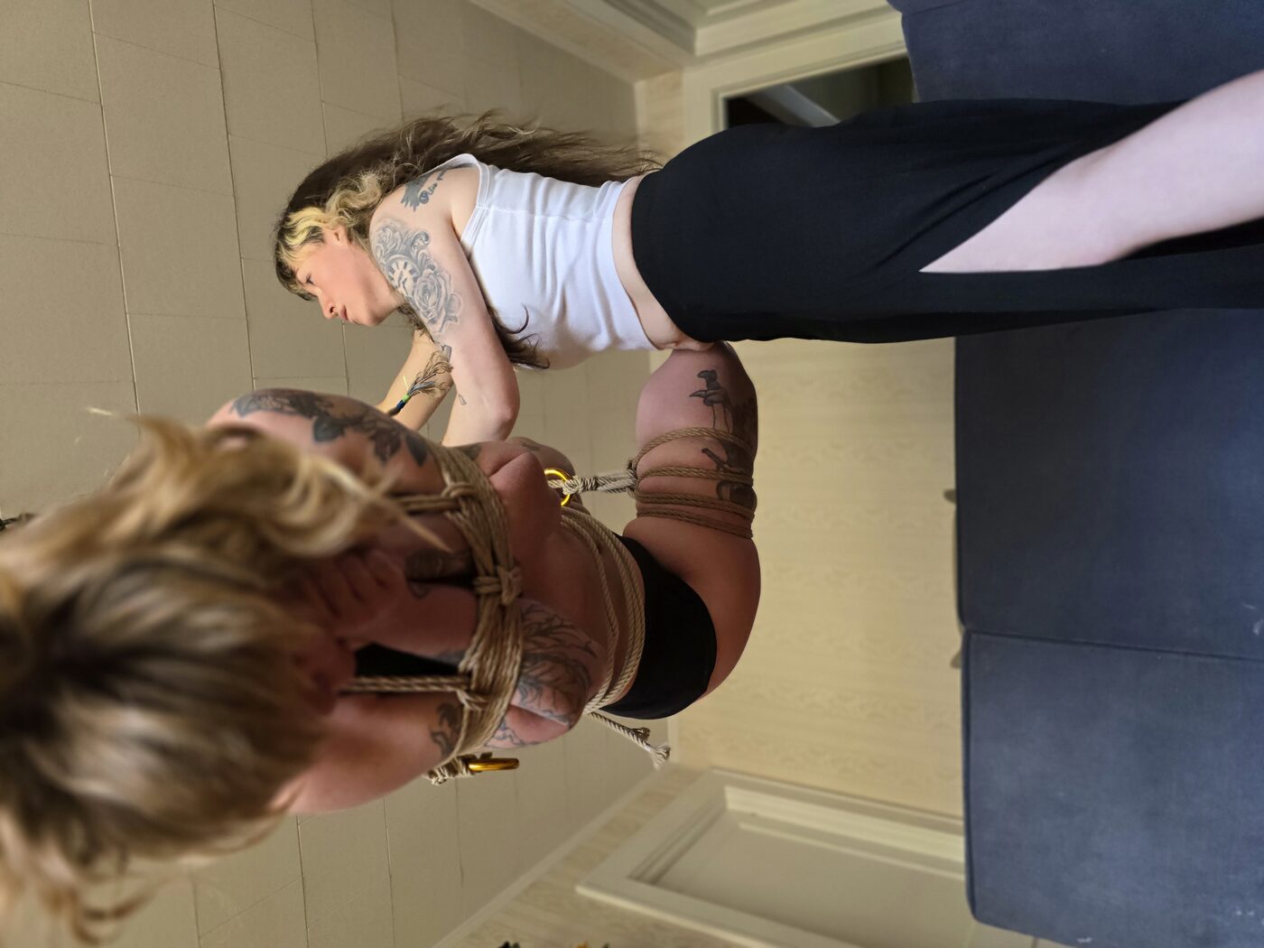 EmJ smiling while tying